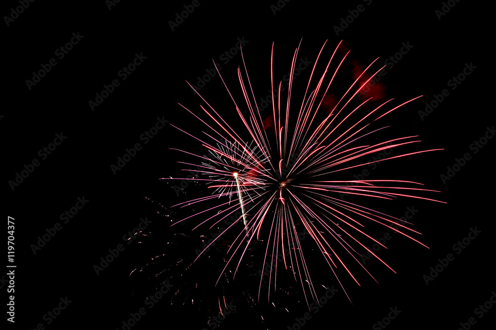 Red fireworks light the sky on the 4th of July Red fireworks light the sky on the 4th of July