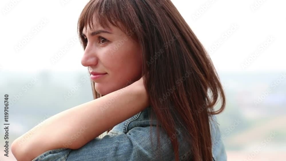 The girl's profile on the sky background