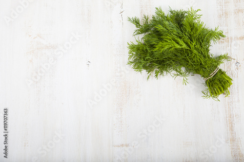 Dill on a wooden background