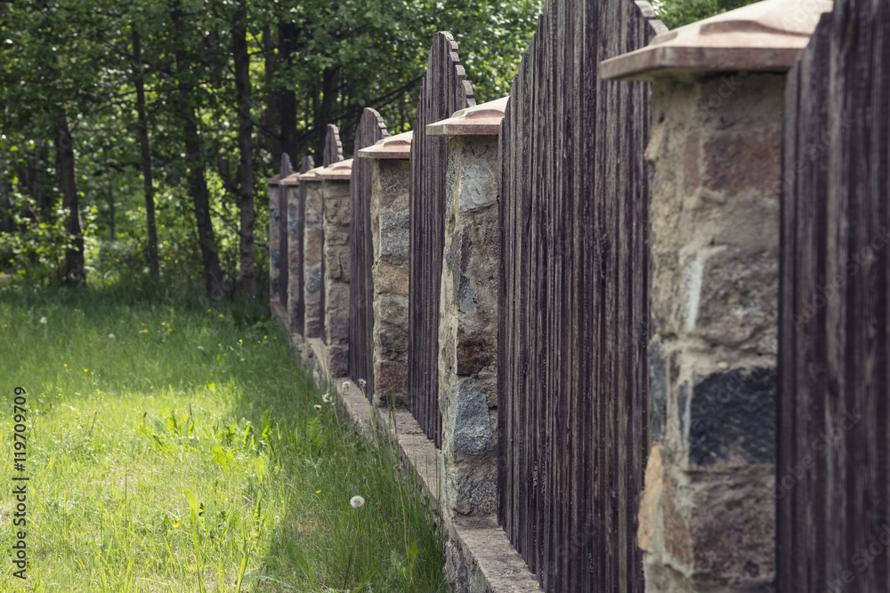 the fence of a country house