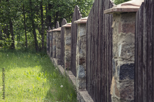 the fence of a country house