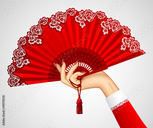 Female hand with open vintage red fan isolated on white