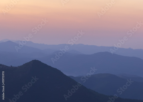 Silhouettes of the mountain hills after sunset. mountain cascade © EdVal