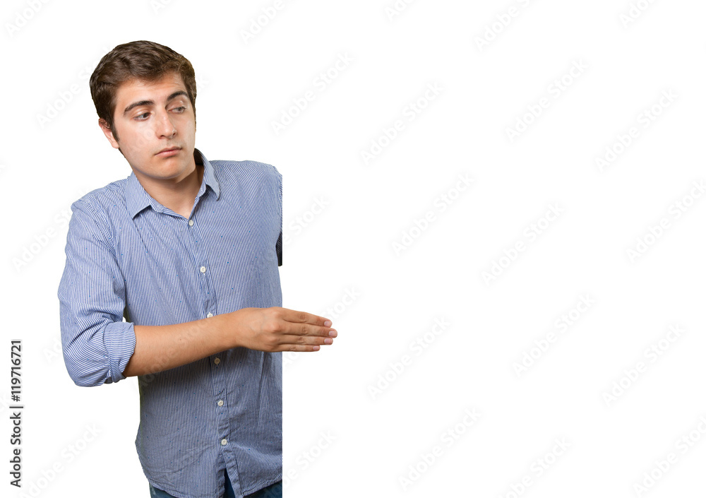 Pensive young man holding a blank Pensive young man holding a blank