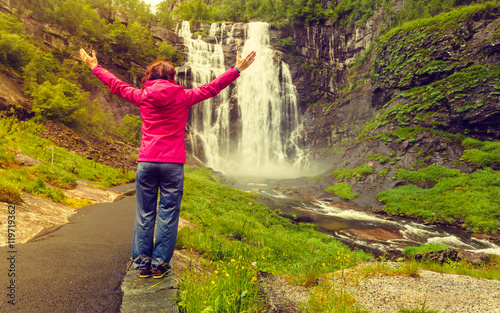 Tourist woman by Skjervsfossen Waterfall - Norway
