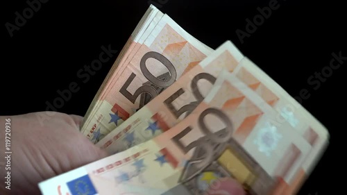 person counts the euro money bills photo