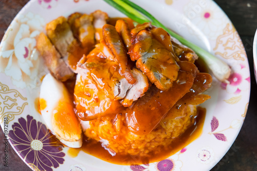 Khao Moo Dang or barbuced red pork in sauce with rice. A single