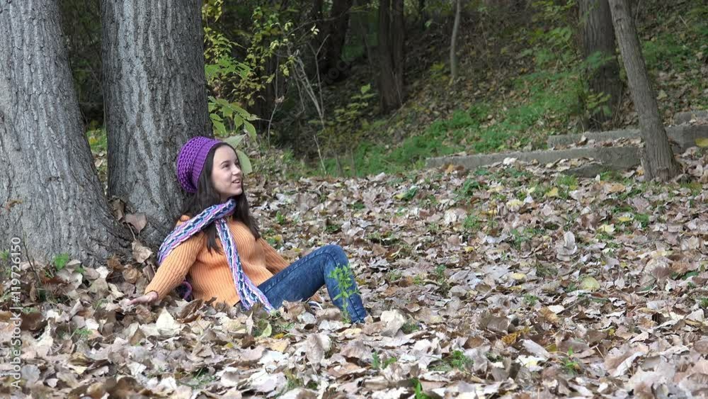 Little Girl Enjoy Sitting in Autumn Forest Leaves Little Girl Enjoy Sitting in Autumn Forest Leaves