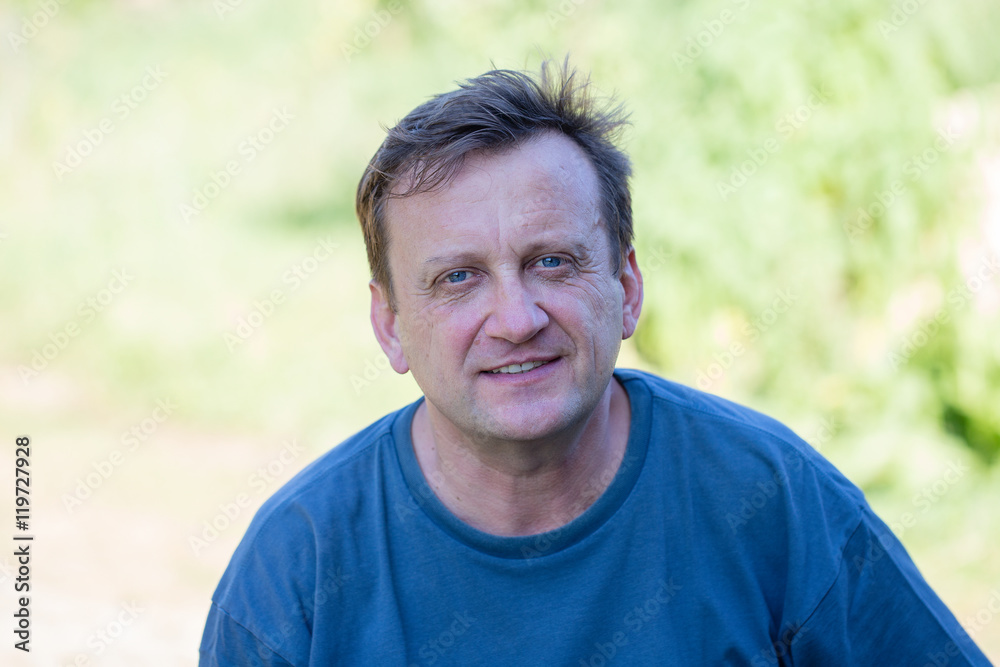 Portrait of middle-aged man relaxing in nature, close up Portrait of middle-aged man relaxing in nature, close up