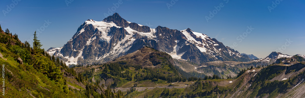 Mt. Shuksan, Washington. Mount Shuksan may be one of the most photographed mountains in the Cascade Range seen here on the Chain Lakes Loop Trail. Mt. Baker National Forest. Mt. Shuksan, Washington. Mount Shuksan may be one of the most photographed mountains in the Cascade Range seen here on the Chain Lakes Loop Trail. Mt. Baker National Forest.