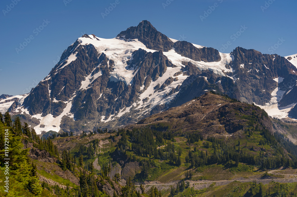 Mt. Shuksan, Washington.  Mount Shuksan may be one of the most photographed mountains in the Cascade Range seen here on the Chain Lakes Loop Trail. Mt. Baker National Forest.