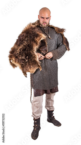 Photography Medieval viking in chain mail and a bearskin rug