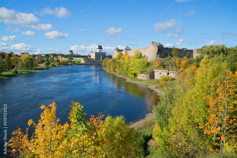 Sunny september day on the border river Narva. Look at the Russian Ivangorod fortress and the Estonian Hermann castle