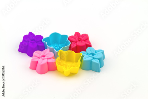 Colorful of silicone molds for baking in the form of hearts on white background