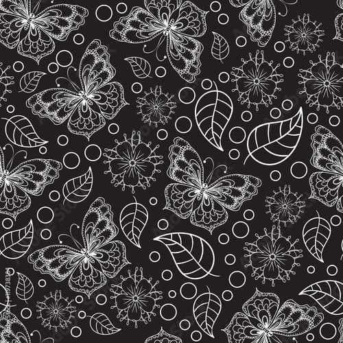Seamless texture. Black and white pattern of butterflies, flowers and leaves.