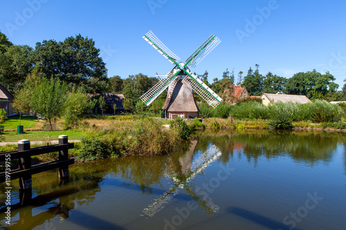 Classic Dutch windmills in nature with blue sky in the background