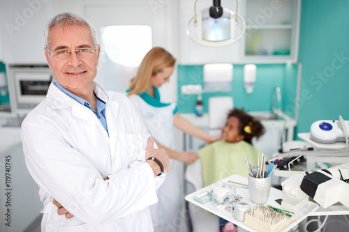 Experienced dentist in dental practice