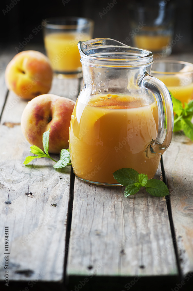 Fresh peach juice with mint on the wooden table