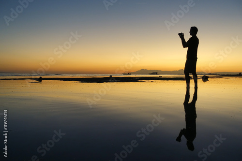 Photographer on beach - Silhouette at Sunset