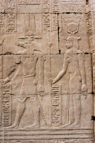 Hieroglyphic carvings on the exterior walls of egyptian temple