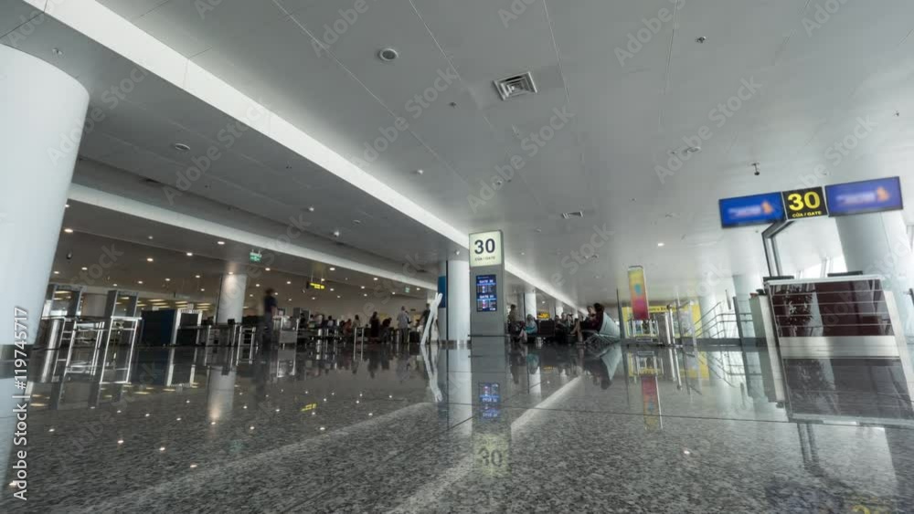 Timelapse low angle shot of people traffic in airport terminal and security checkpoint