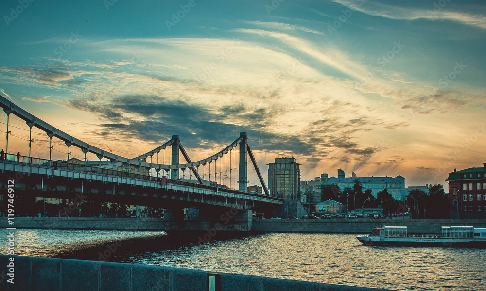 Beautiful sunset at quay Moscow river with amazing clouds