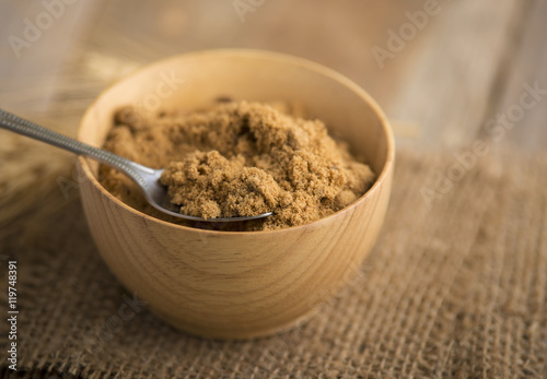 coconut palm sugar against an out of focus