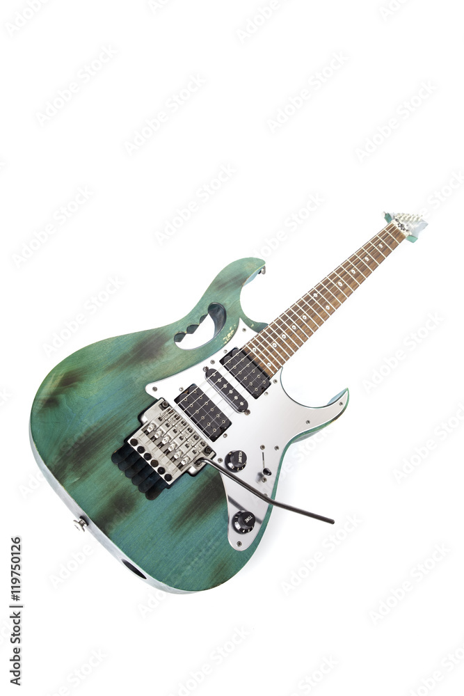 Fototapeta premium Road worn modern elecric rock guitar, Studio shot of instrument isolated against white background.