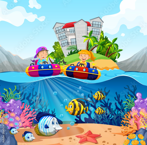 Two kids riding on rubber boats in ocean