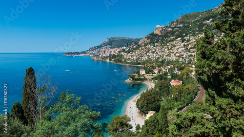 Bay and coastline of Roquebrune-Cap-Martin, Southern France with the city state of Monaco in the distance.