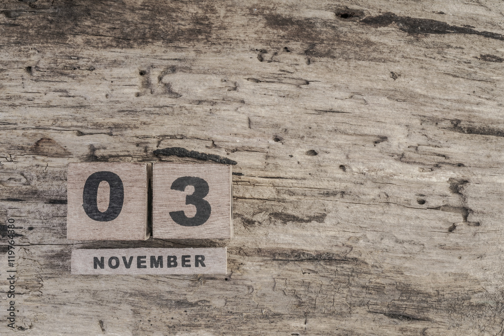 cube calendar for november on wooden surface with copy space cube calendar for november on wooden surface with copy space