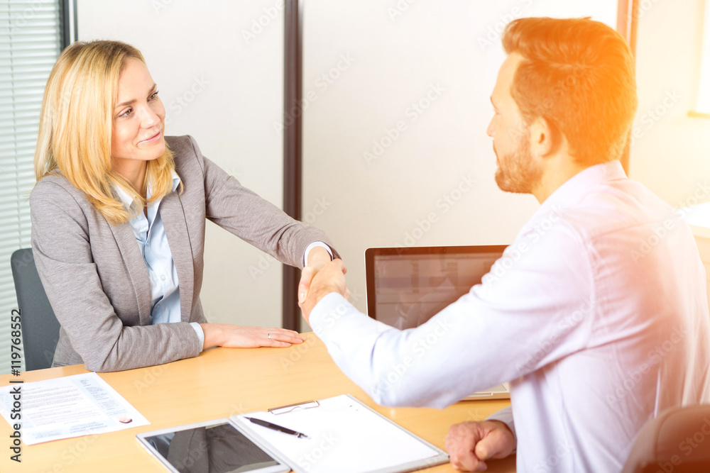 Two workers working outside on a construction site