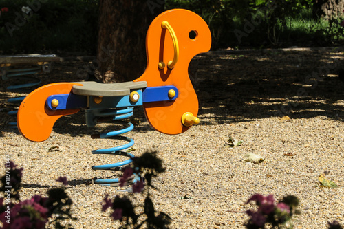 Εκτύπωση καμβά Orange horse teeter on the blue spring in sunlight