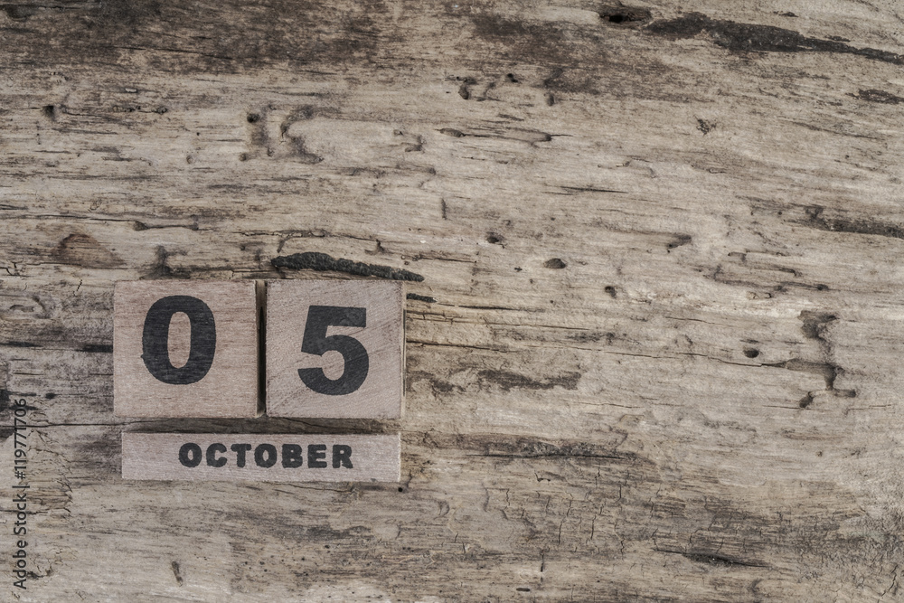 Cube calendar for october on wooden background with copy space Cube calendar for october on wooden background with copy space