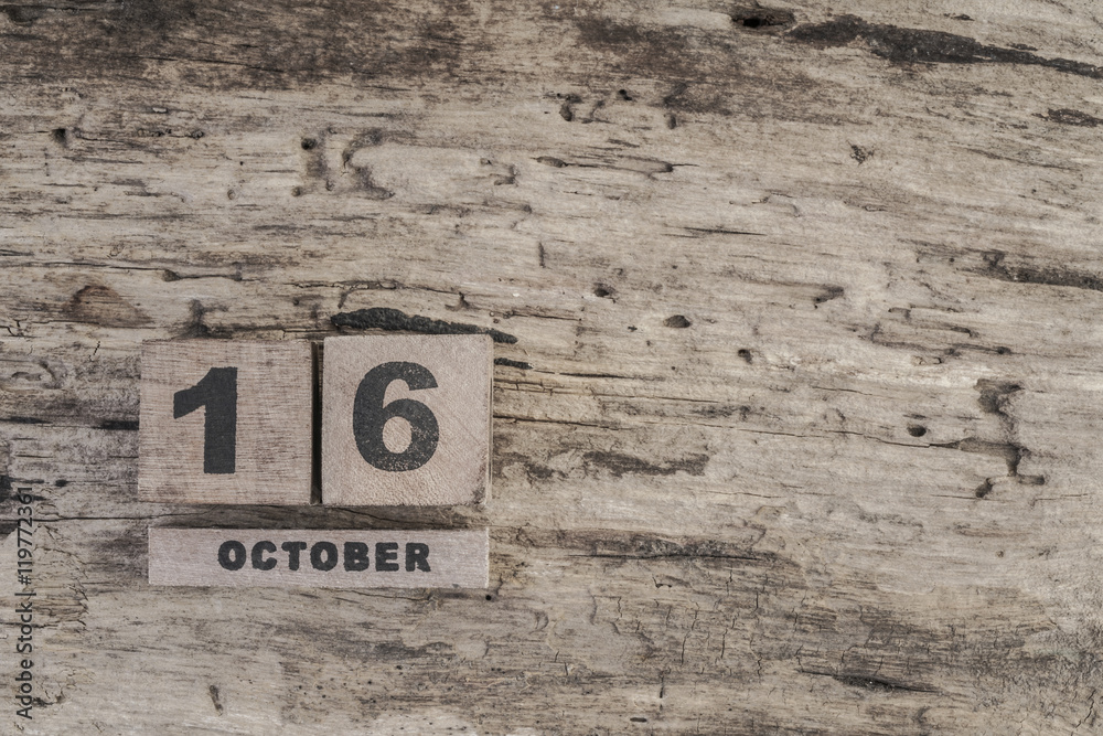 Cube calendar for october on wooden background with copy space Cube calendar for october on wooden background with copy space