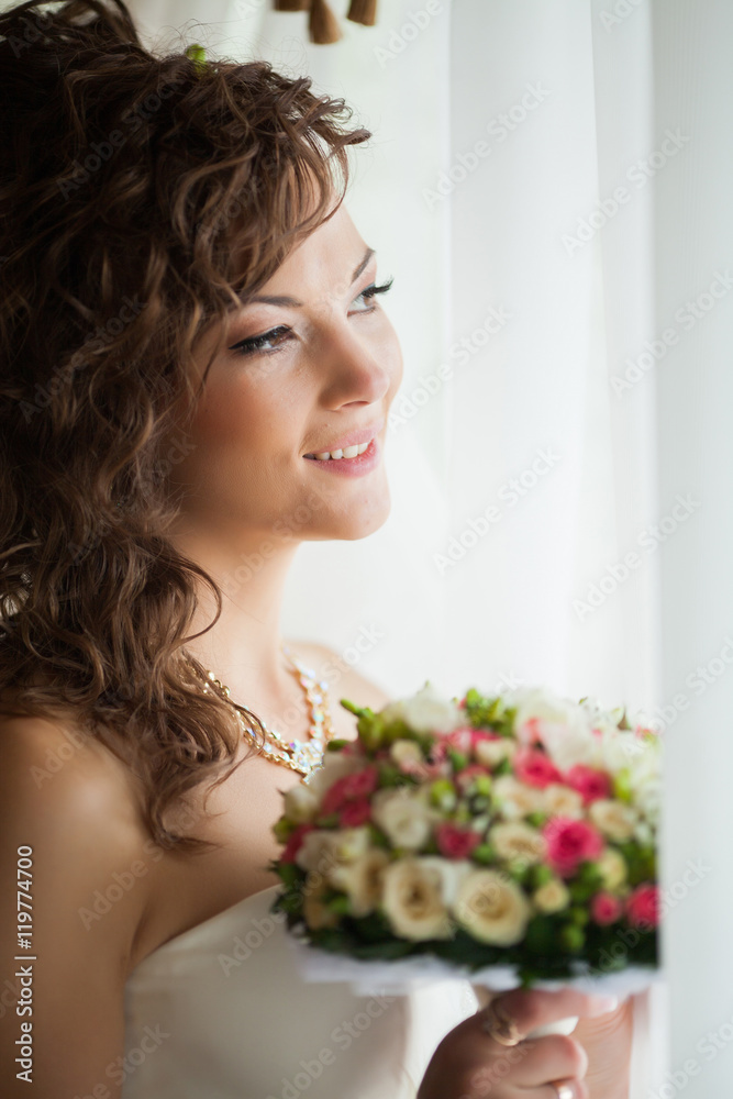 Beautiful young bride with wedding makeup and hairstyle in bedroom, newlywed woman final preparation for wedding. Happy Bride waiting groom. Marriage Wedding day moment. Bride portrait soft focus Beautiful young bride with wedding makeup and hairstyle in bedroom, newlywed woman final preparation for wedding. Happy Bride waiting groom. Marriage Wedding day moment. Bride portrait soft focus