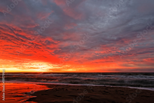 Orange sunset on the beach. Baltic Sea.