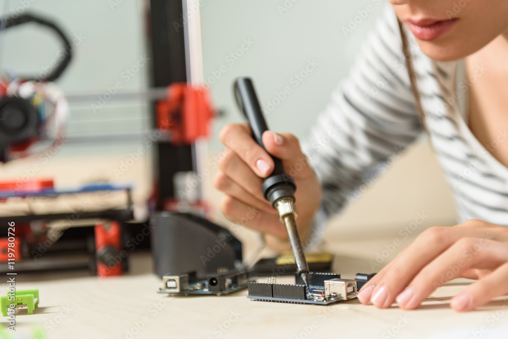 Professional female engineer designing 3d technology Professional female engineer designing 3d technology