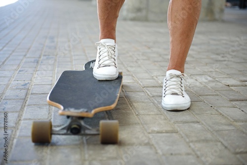 Young man skateboarding on street