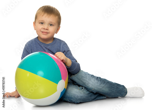 boy plays with a ball