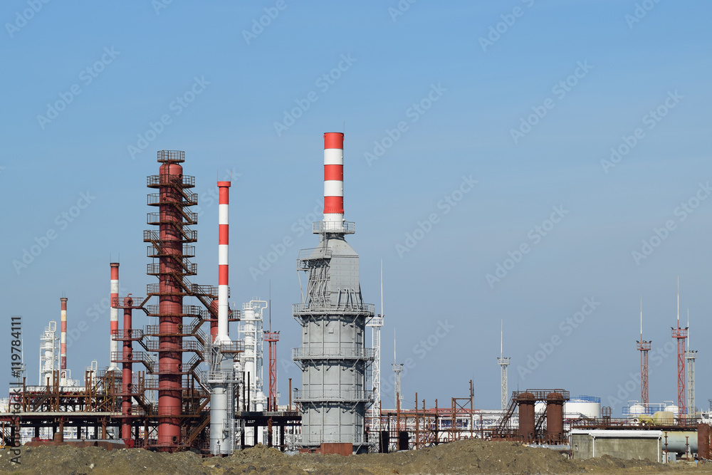 Obraz premium Distillation columns, pipes and other equipment furnaces refinery.