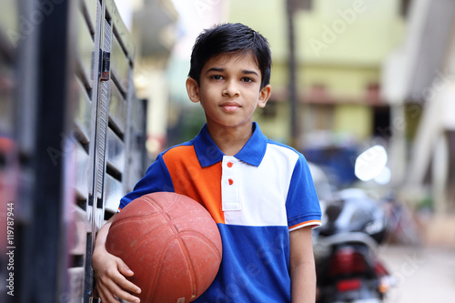 Portrait of indian boy with Basketball
