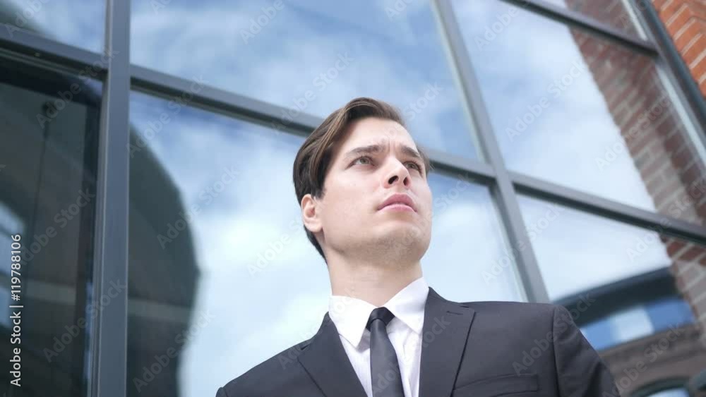 Young Businessman, Looking and Waiting for Customer Young Businessman, Looking and Waiting for Customer