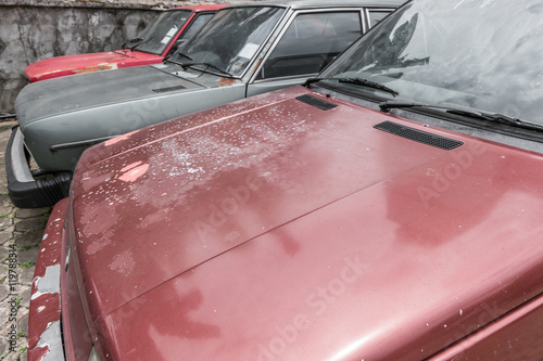 Close up of three old cars in row
