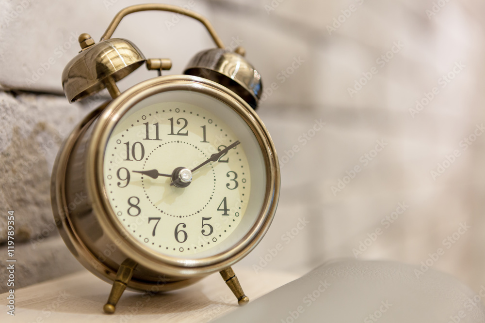 Retro alarm clock on table Retro alarm clock on table