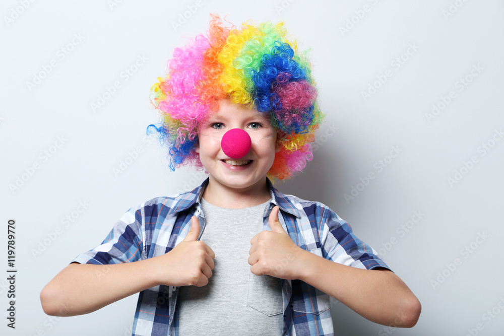 Portrait of little boy clown on grey background Portrait of little boy clown on grey background