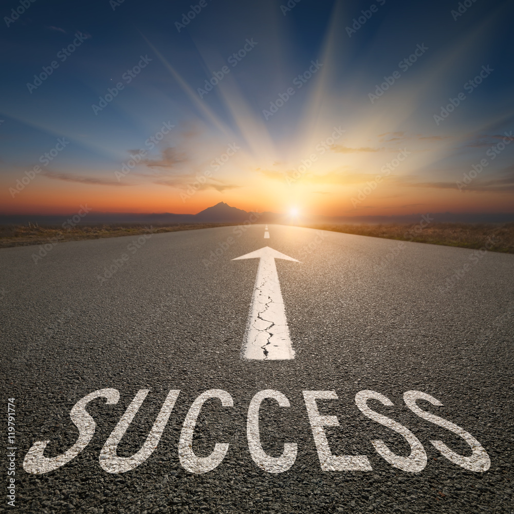 Business concept on an open road with success text