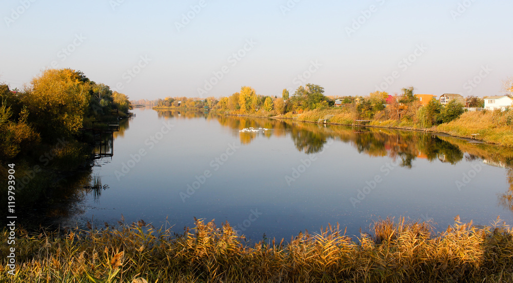 Reflection in the river. Autumn landscape