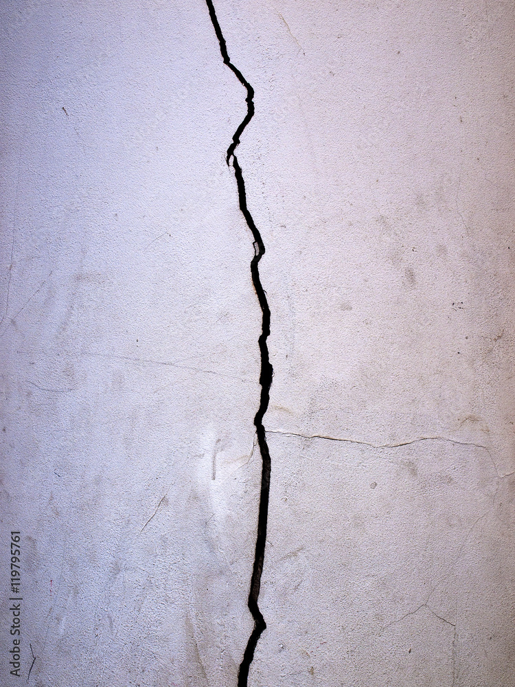 Grunge concrete cement wall with crack in building Grunge concrete cement wall with crack in building