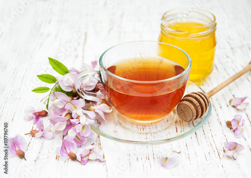 tea and honey with acacia blossoms